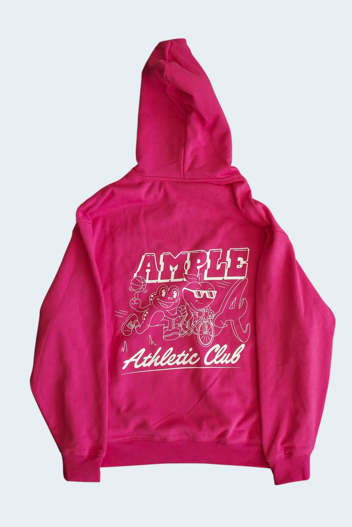AMPLE pink French terry long sleeve hoodie with white graphic print on the back featuring a cartoon character